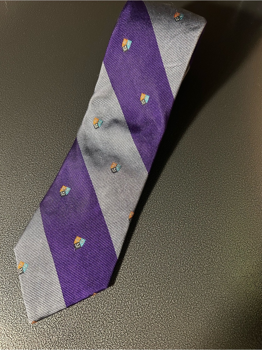 Striped Purple and Gray Men's Tie with Embroidered Crest by Stallings Frazier